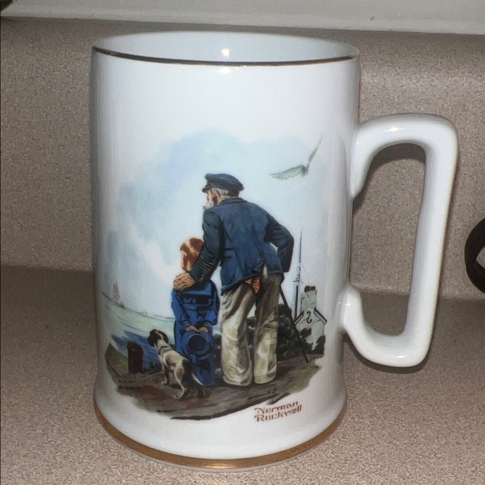 Norman Rockwell Blue and White Mug with Gold Trim dog dock fishing scene